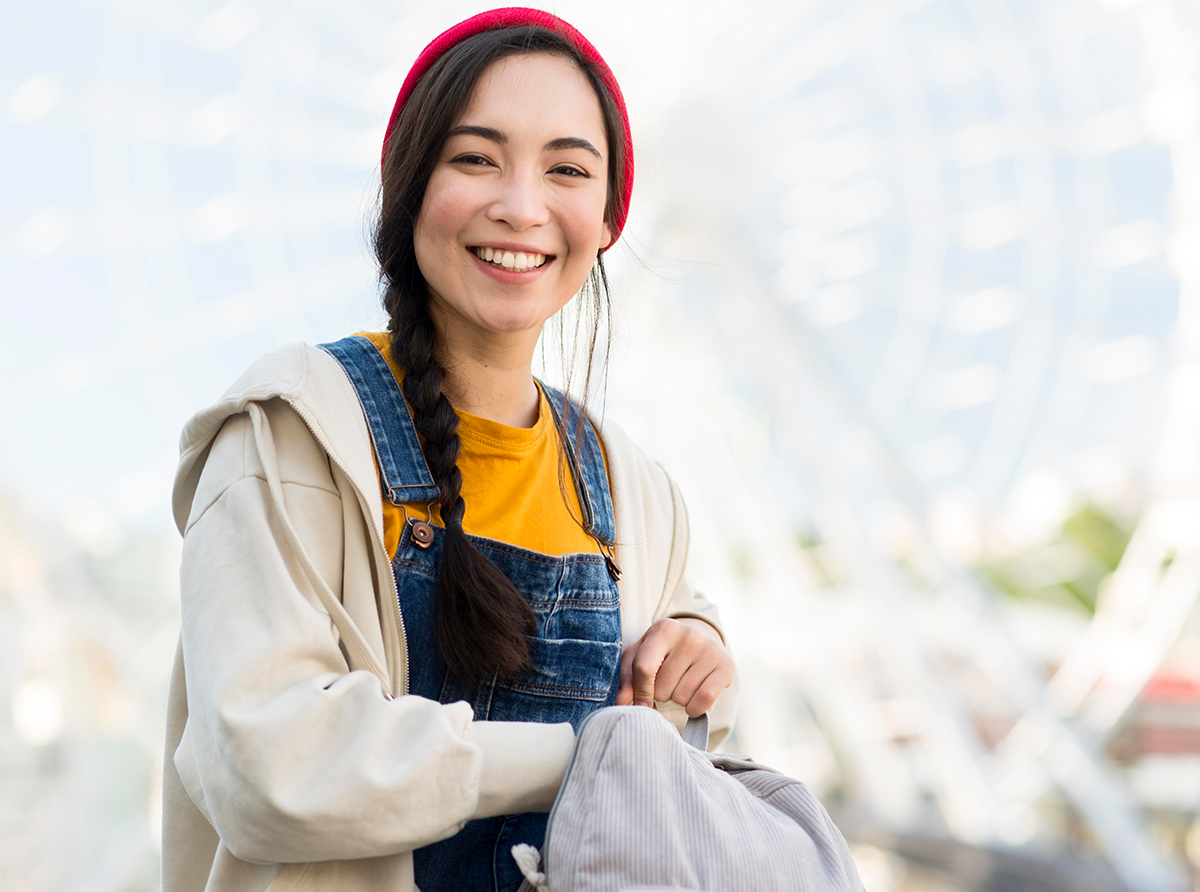 A happy student inside a university campus, focused on learning and development.